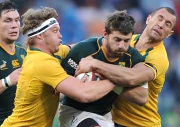 Green machine: South Africas Willie le Roux, centre, scored South Africas third try. Picture: Getty