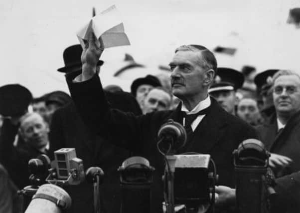 It is peace for our time  on this day in 1938, Neville Chamberlain waves a peace agreement signed by Hitler. Picture: Getty