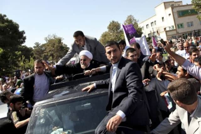 President Rouhani arrived back in Tehran at the weekend, where he was met by both supporters and protesters. Picture: AP Photo