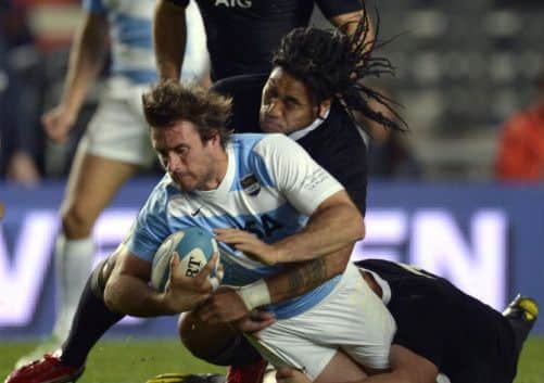 Argentina centre Marcelo Bosch is tackled by his All Black counterpart Maa Nonu and and try-scoring flanker Sam Cane. Picture: Getty
