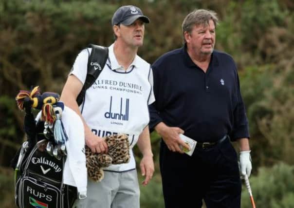 Johann Rupert, the driving force behind the Dunhill brand, talks to his caddie at Kingsbarns last week. Picture: Getty