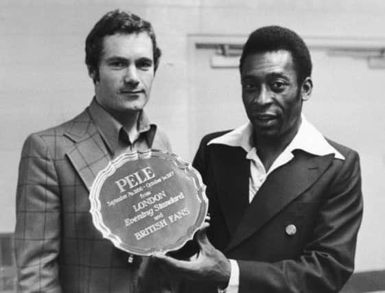On this day in 1977, Brazilian footballer Pele, pictured, right, with journalist Michael Hart, announced his retirement. Picture: Getty