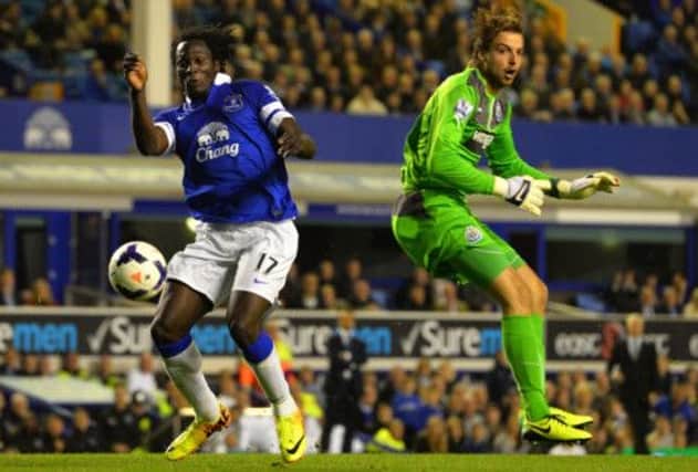 Romelu Lukaku beats Newcastle goalkeeper Tim Krul to the ball to put Everton 3-0 up in the first half last night. Picture: Getty