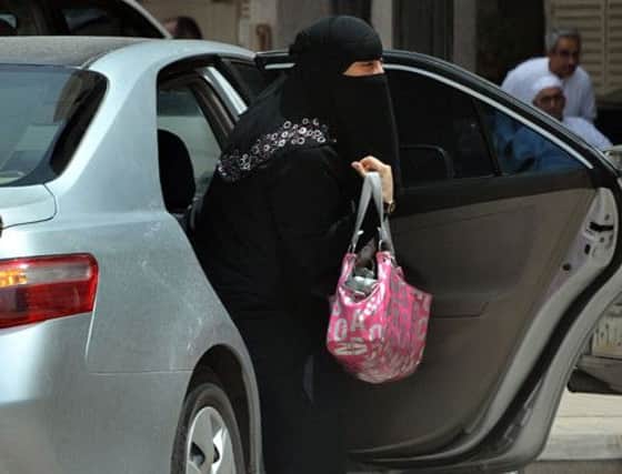 A Saudi woman gets out of the back of a car. Picture: Getty
