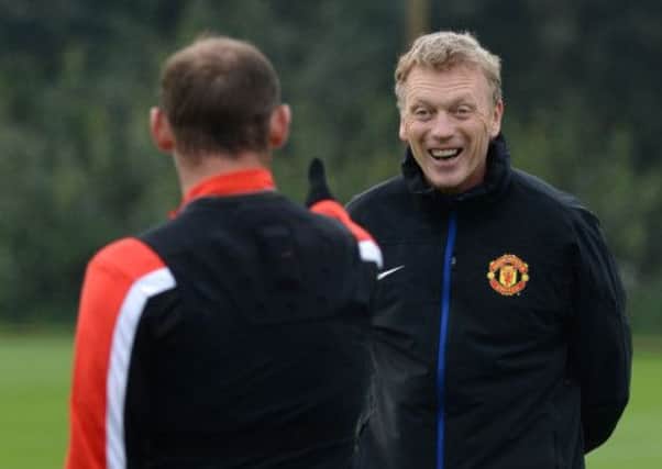 Manchester United manager David Moyes jokes with Wayne Rooney during training yesterday. Picture: PA
