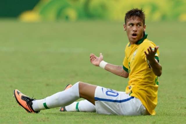 A common sight as Neymar sits on the ground looking for a foul. Picture: Getty