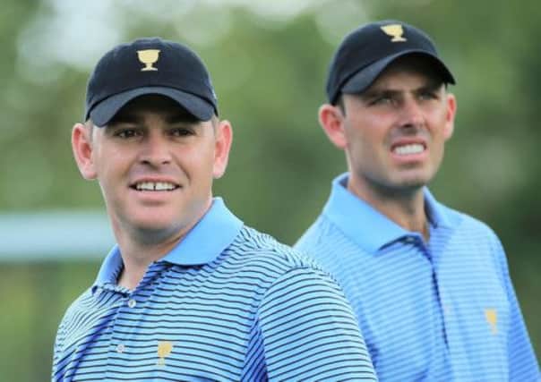 Louis Oosthuizen, left, and Charl Schwartzel were keeping their hats on during practice for the Presidents Cup. Picture: Getty