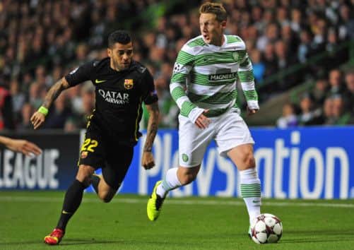 Dani Alves pursues Kris Commons. Picture: Robert Perry