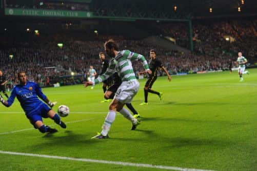 Celtics Georgios Samaras tries to force the ball past Barcelona goalkeeper Victor Valdes. Picture: Robert Perry