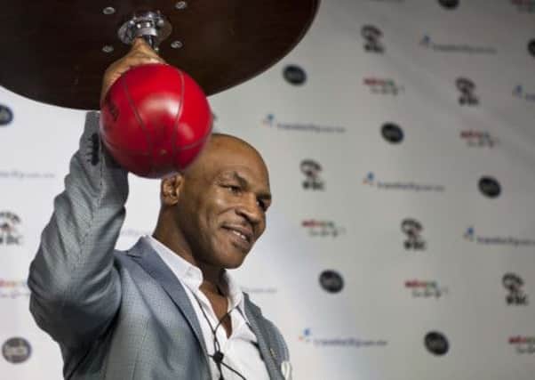 Former world champion Mike Tyson has been urged not to lure Olympic hopefuls to turn pro. Picture: AP