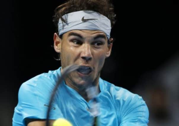 Rafael Nadal returns a shot against Philipp Kohlschreiber enroute to a straight-sets victory in the China Open. Picture: Reuters