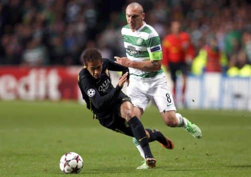 Neymar goes down under a challenge from Scott Brown. Picture: Getty