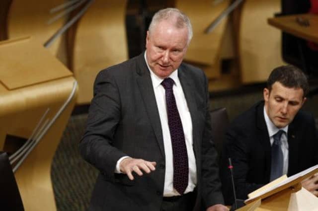 Alex Neil MSP answers questions on the IT issues on Wednesday. Picture: Scottish Parliamen t