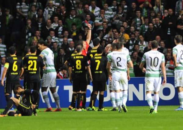 Scott Brown is red carded for his kick at Neymar. Picture: Robert Perry