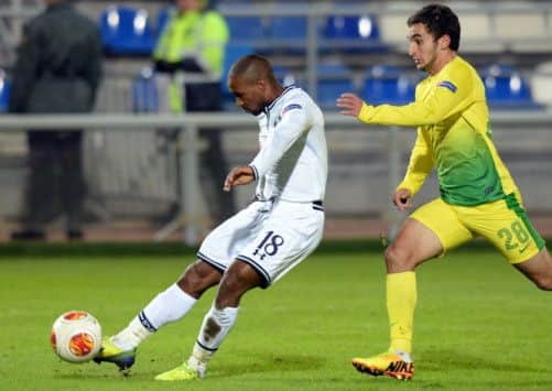 Jermain Defoe is pursued by Anzhi Makhachkalas Serder Serderov during Tottenhams comfortable win. Picture: AFP/Getty