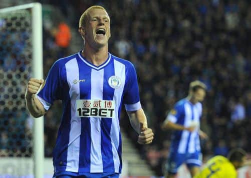 Ben Watson celebrates scoring Wigans second goal in their 31 Europa League win over Slovenians Maribor last night. Picture: PA