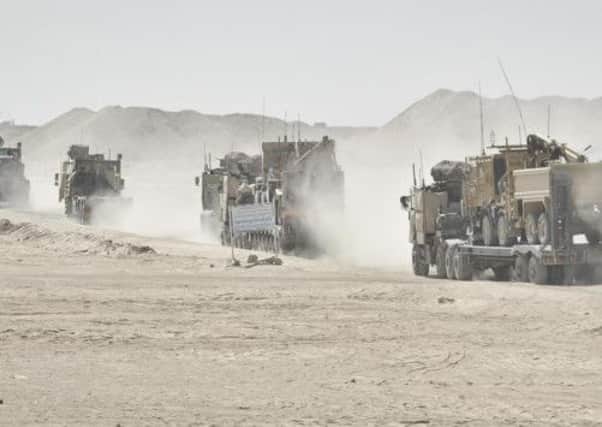 An army logistics convoy quits Nahr-e Saraj, Helmand, Afghanistan, bound for Camp Bastion. Picture: PA
