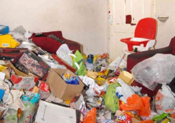 A police photograph shows the squalor in Hutton's livingroom. Picture: AP
