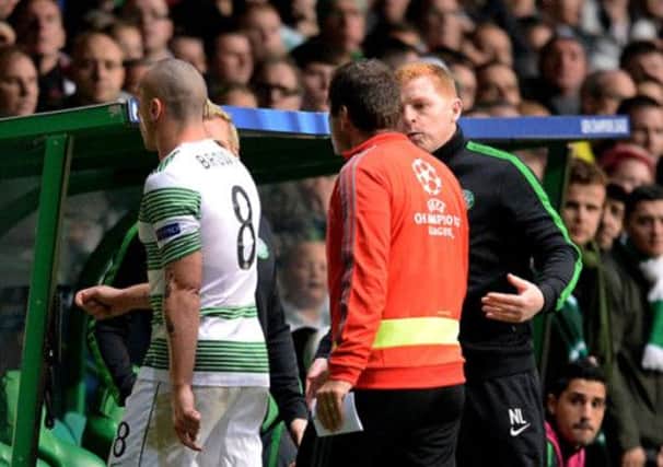 Celtic manager Neil Lennon remonstrates with the fourth official after captain Scott Brown is sent off. Picture: SNS