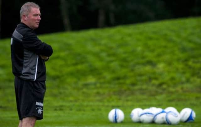 Ally McCoist oversees training and will look forward to focusing on football today after a week dominated by how much he gets paid. Picture: SNS