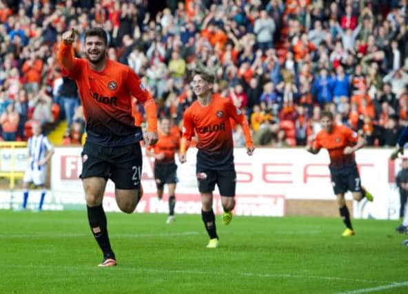 Nadir Ciftci wheels away to celebrate his goal. Picture: SNS