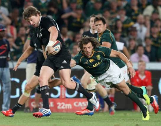 Beauden Barrett of the All Blacks breaks clear to score the bonus point winning fourth try. Picture: Getty
