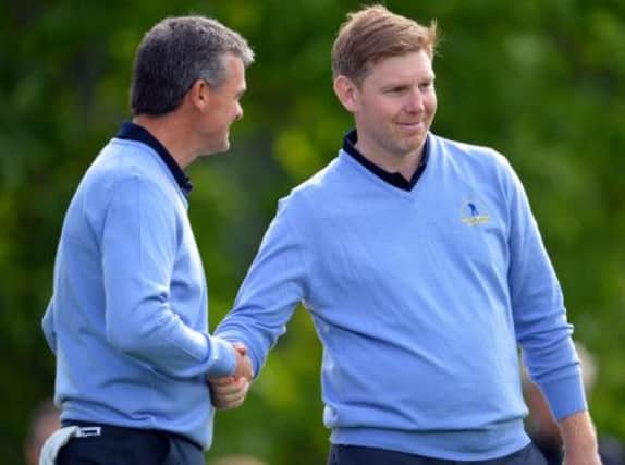 Paul Lawrie and Stephen Gallacher of Great Britain and Ireland shake hands after their win. Picture: Getty