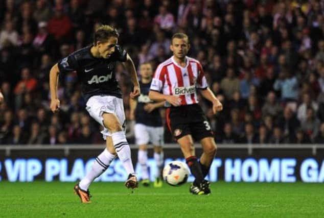 Manchester United's Adnan Januzaj sidefoots home the equalier on his debut. Picture: PA