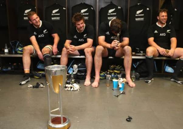 From left, Kieran Read, Richie McCaw, Sam Whitelock and Tawera Kerr-Barlow celebrate in the dressing room. Picture: Getty