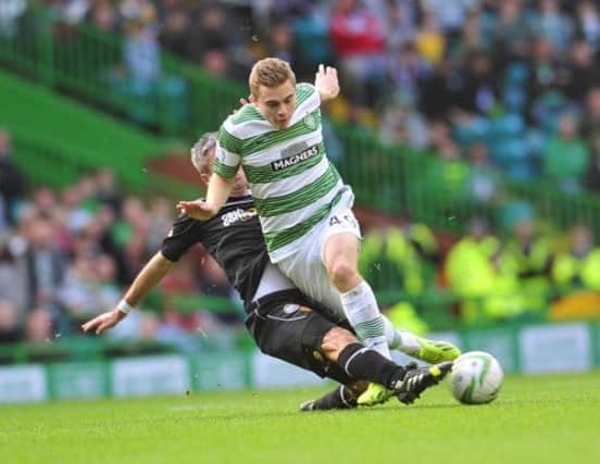 James Forrest is tackled by Motherwells Keith Lasley as the winger continued his comeback. Picture: Robert Perry