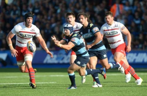 Cardiff Blues' British and Irish Lion, Leigh Halfpenny spins the ball out wide during the match against Edinburgh. Picture: Camerasport