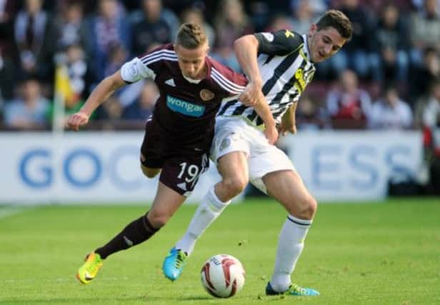 Hearts substitute Billy King tussles with Kenny McLean of St Mirren during Saturday's match at Tynecastle. Picture:Jane Barlow