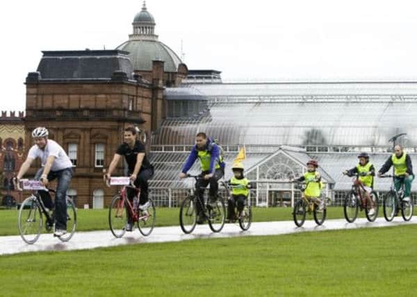 Sir Chris Hoy and Ross Edgar encourage members of the public to get on their bikes. Picture: SNS