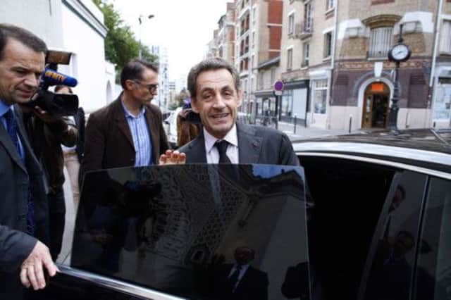 Former president Nicolas Sarkozy leaves Paris Great Mosque yesterday; he made no comment on the dropped inquiry. Picture: AFP/Getty