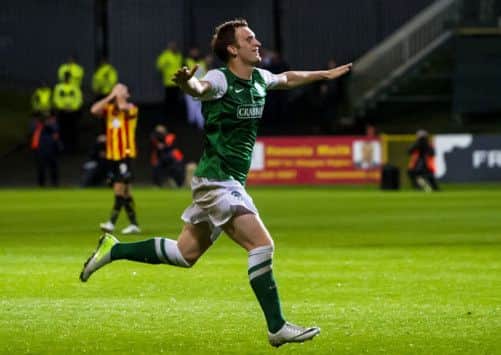Liam Craig races off to celebrate after opening the scoring. Picture: SNS