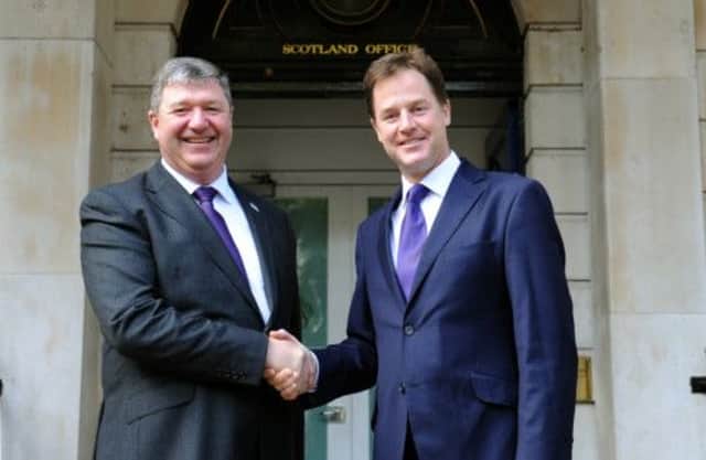 Alistair Carmichael (left) who has replaced Michael Moore, is greeted by Deputy Prime Minister Nick Clegg. Picture: PA