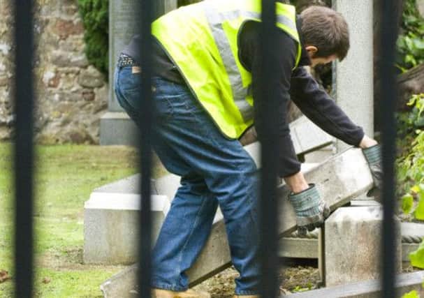Long-term prisoners near the end of their sentences will help repair and make safe graveyard memorials. Picture: Ian Georgeson