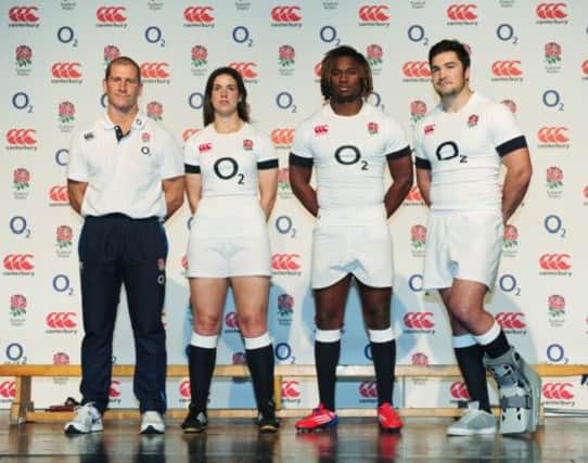 Stuart Lancaster, left, with England players Sarah Hunter, Marland Yarde and Brad Barritt at the launch of their new kit yesterday. Picture: PA
