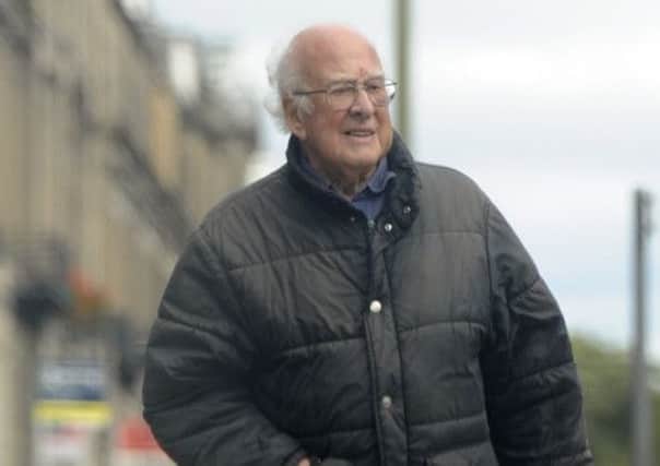 Professor Peter Higgs pictured outside his New Town house after winning the Nobel Prize. Picture: Greg Macvean