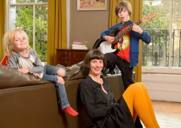 Charlotte Raven at home with her children John and Anna. Picture: Fiona Hanson (info@fionahandson.com)