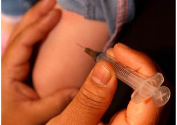 A child is given the measles vaccine. File photo: TSPL