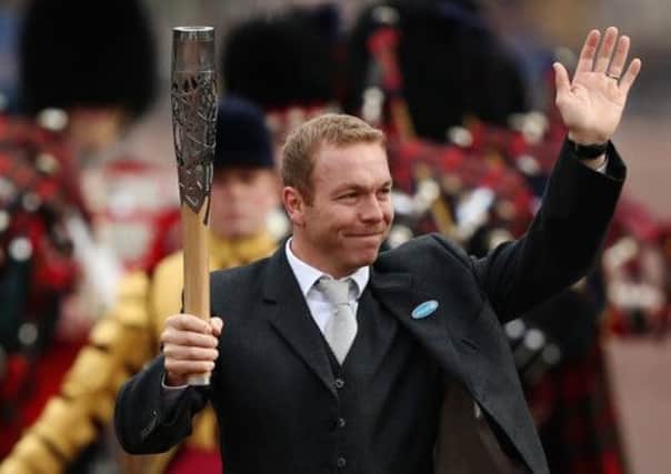 The Commonwealth Games baton, held yesterday by Sir Chris Hoy in London, will leave the UK today for Dehli. Picture: Getty