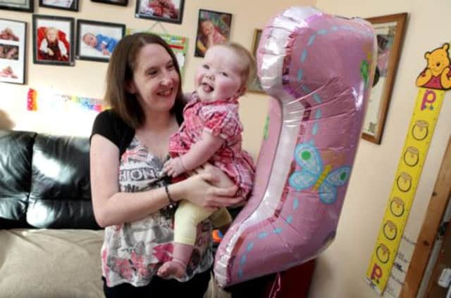 Little Paige Blake from Rosyth whose life could have ended before she was born has turned one. Picture: HEMEDIA