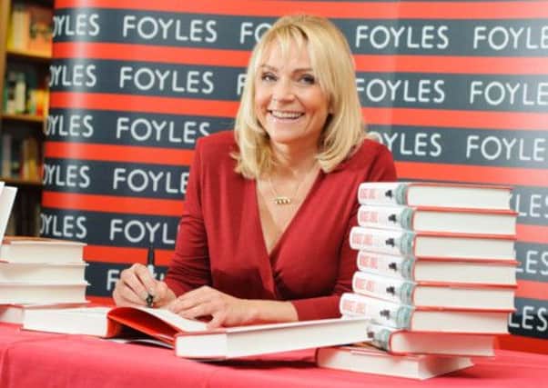 Helen Fielding signs copies of the book in London yesterday. Picture: PA