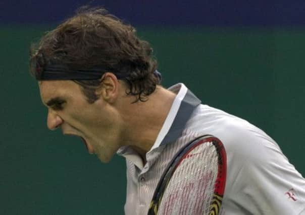 Roger Federer shouts his anguish after losing a point during his defeat by Gael Monfils at the Shanghai Masters yesterday. Picture: AP