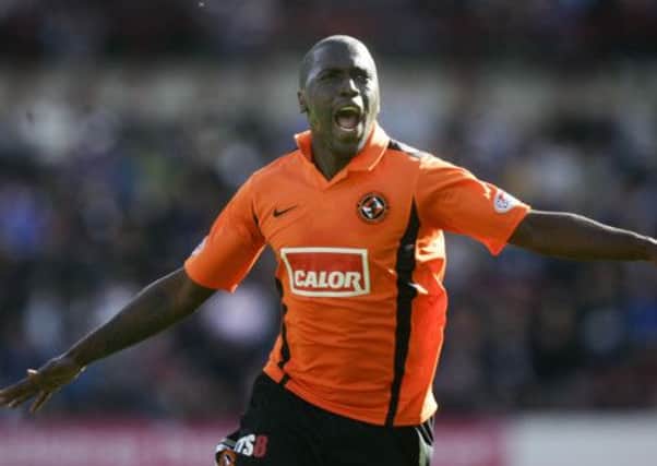 Morgaro Gomis celebrates during his first spell at Dundee United. Picture: Toby Williams
