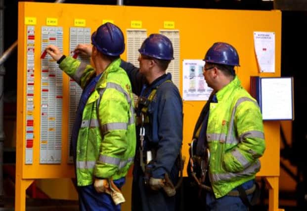 Unlike their US colleagues, staff at BAE sites in Glasgow can still clock in to work. Picture: Getty