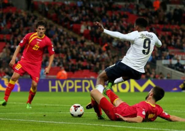 Daniel Sturridge is brought down by Ivan Kecojevic to earn his team a penalty. Picture: The FA  via Getty