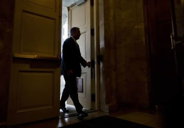 Republican John Boehner, the House Speaker, arrives at Capitol Hill yesterday morning, on what proved to be a long day of negotiations. Picture: AP