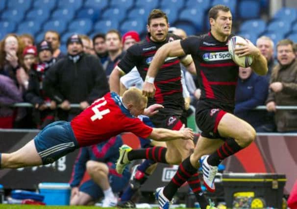 Tim Visser, right, breaks away from Keith Earls to score his side's second try of the game. Picture: SNS